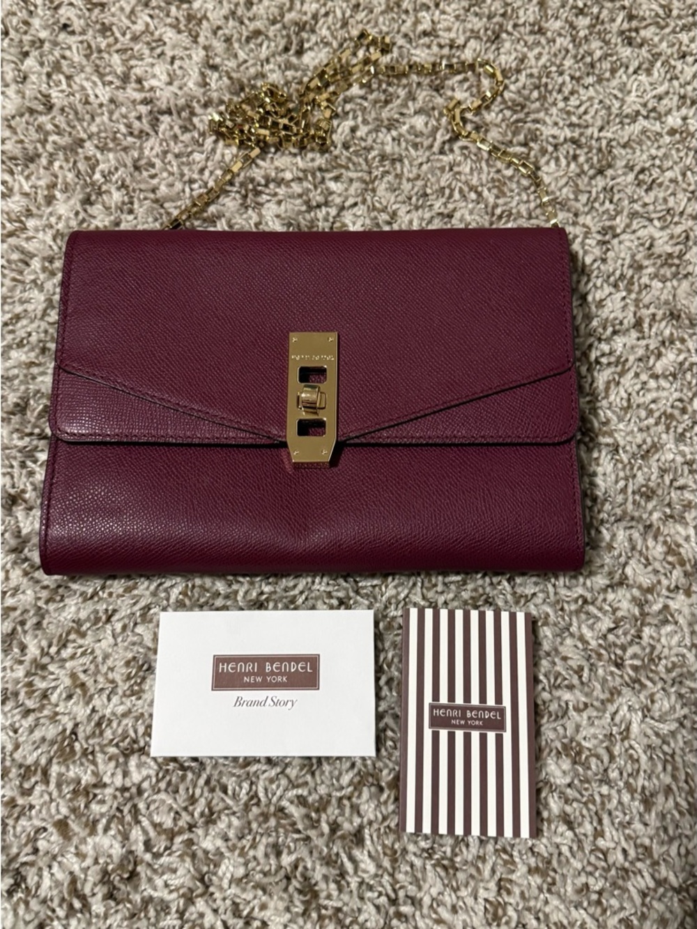 henri bendel burgundy leather chain clutch with gold hardware